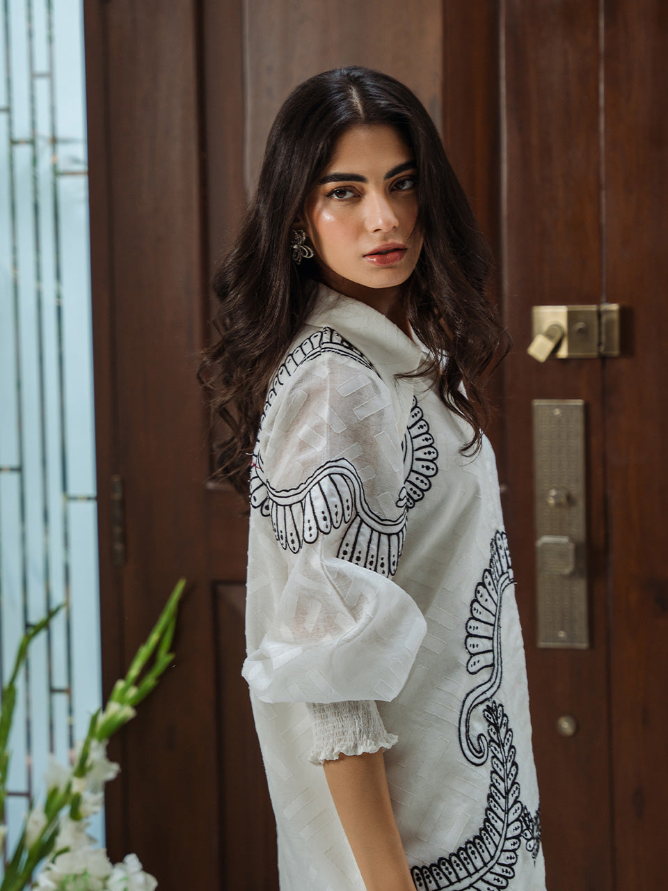 Sophisticated white tunic with detailed handwork