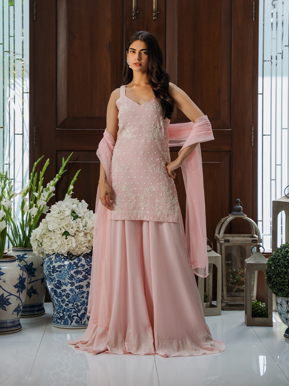 features a delicate peach khaadi net tunic