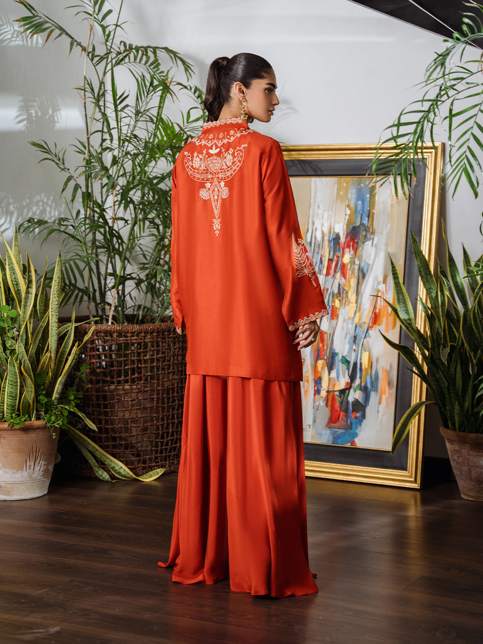 Flared sharara pants with embroidery details in tangerine ensemble