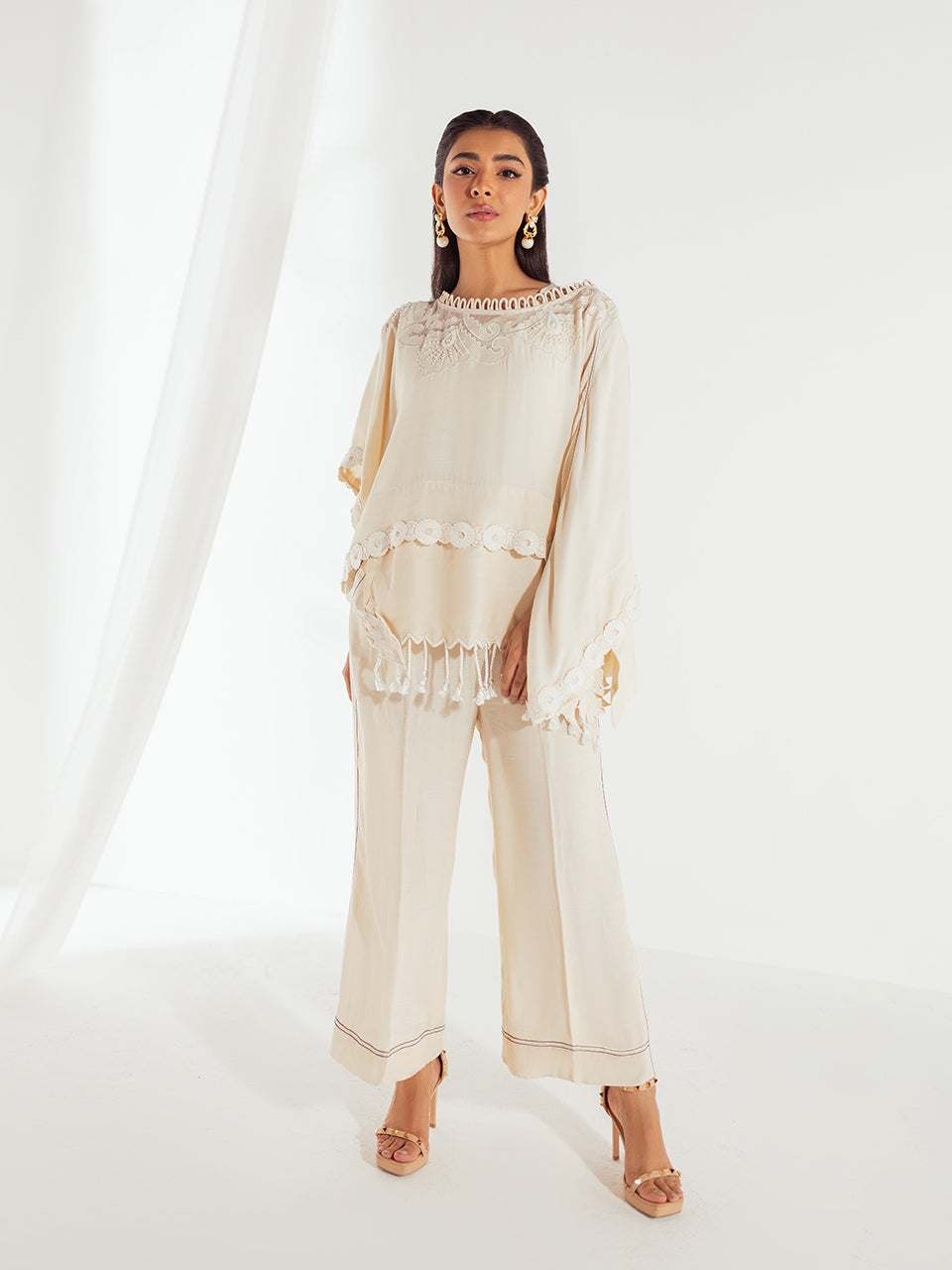 oordinated cream cape and pants ensemble with intricate embroidery