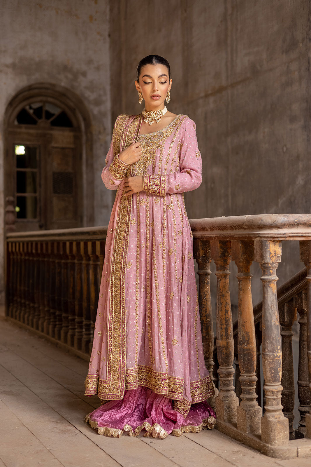 Pink traditional ensemble with cultural heritage detailing