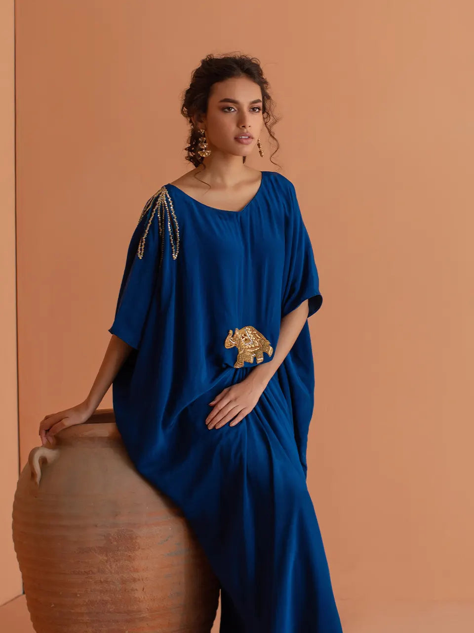Luxurious royal blue silk kaftan with intricate zardozi work