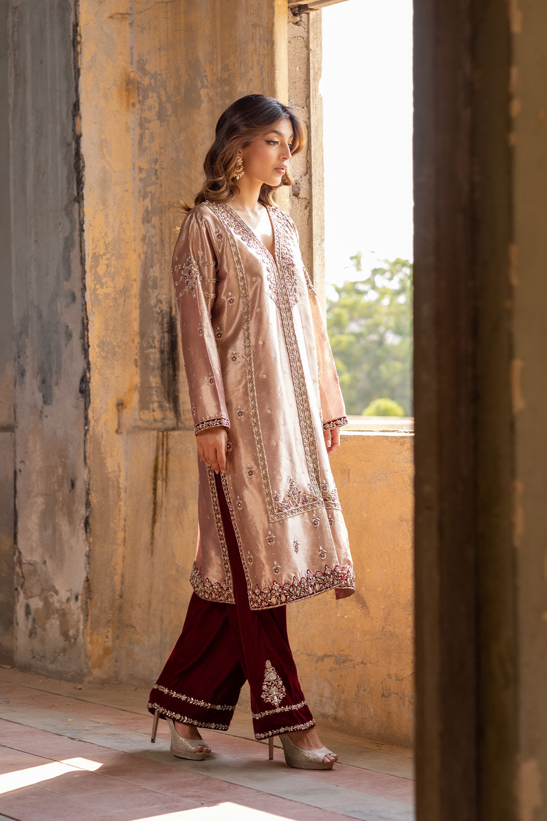  resham and zardozi embellishments, paired with a maroon velvet izhaar